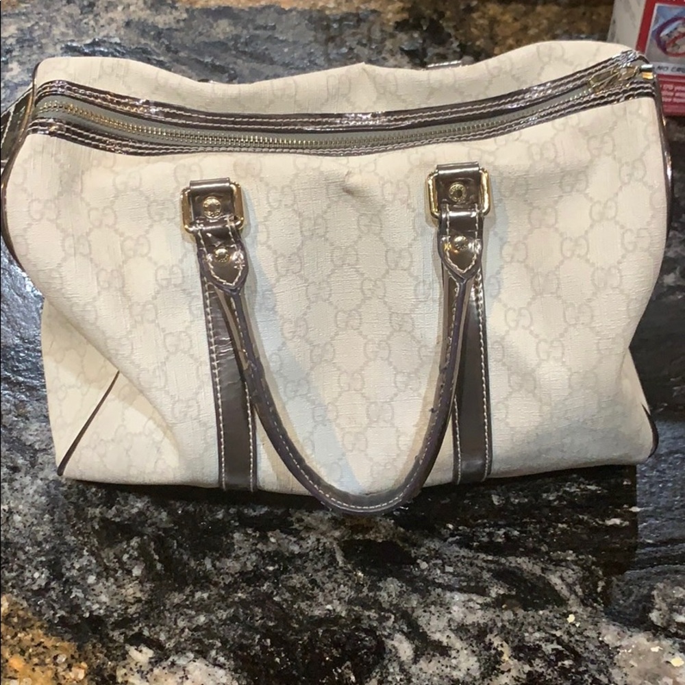 Gucci bag- good condition;worn handle, small tear